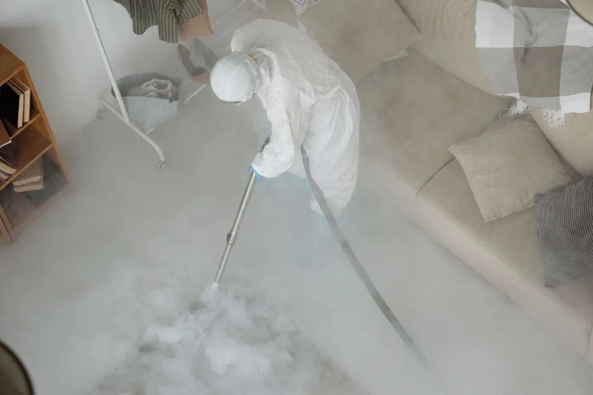 Biohazard cleanup technician in protective equipment, Ardmore, TN